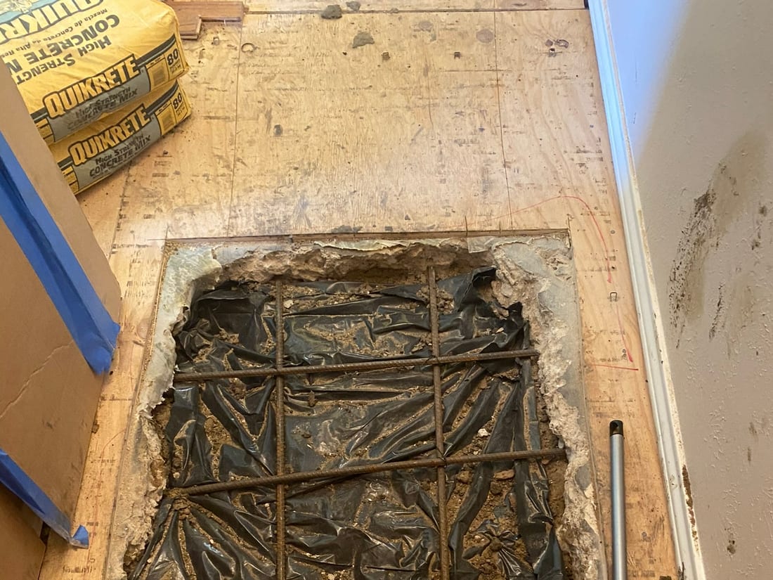 Concrete slab opened for a leak repair by Encore Plumbing